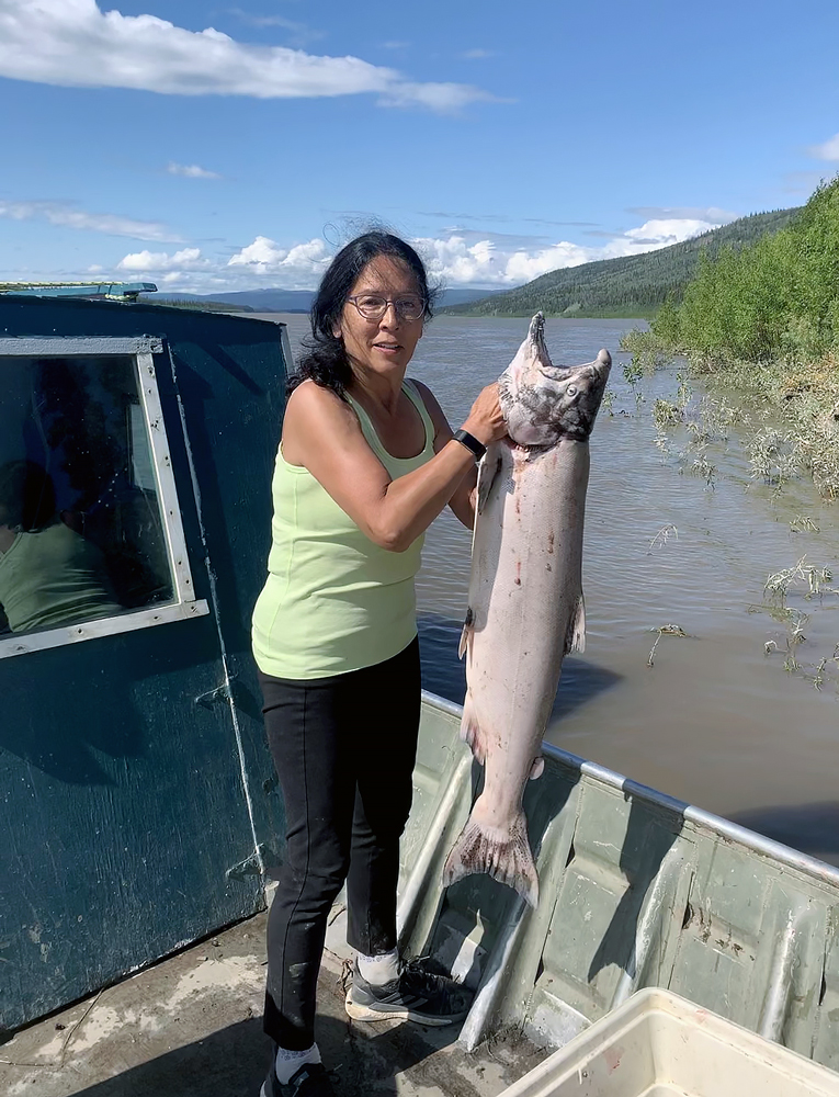 Kathy catching a huge king salmon